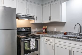 White shaker-style cabinets*